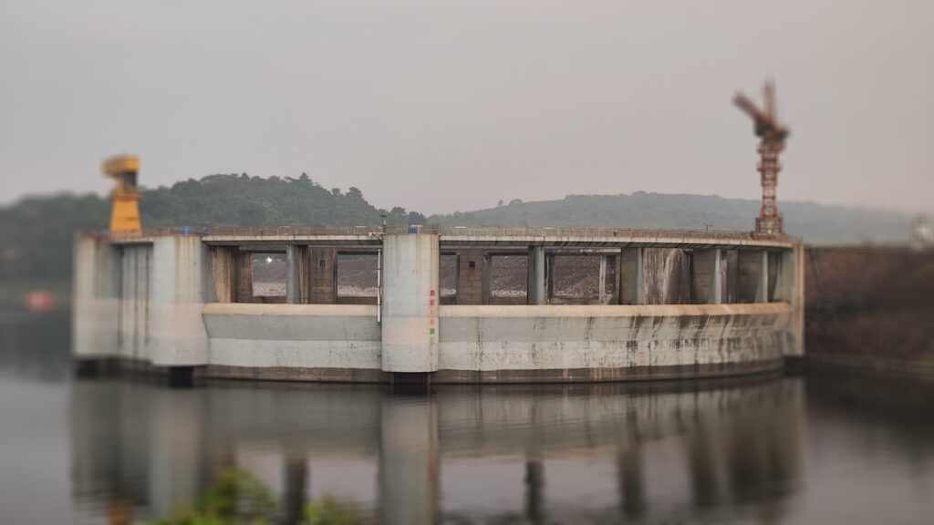 Picture of a circular structure on top of the water, supposedly to control the water when it is flooding.