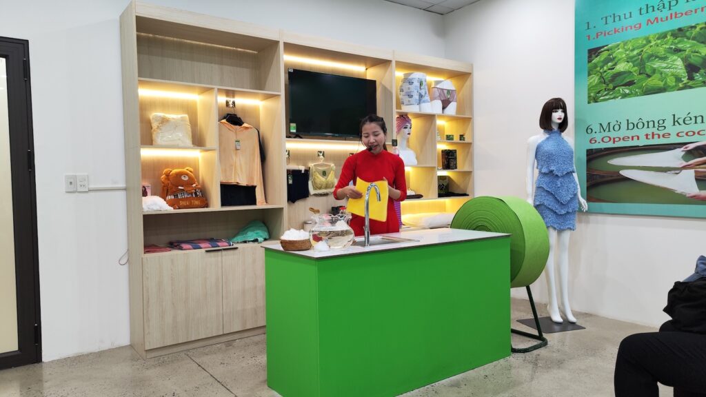 Photo of a woman explaining products she sells.