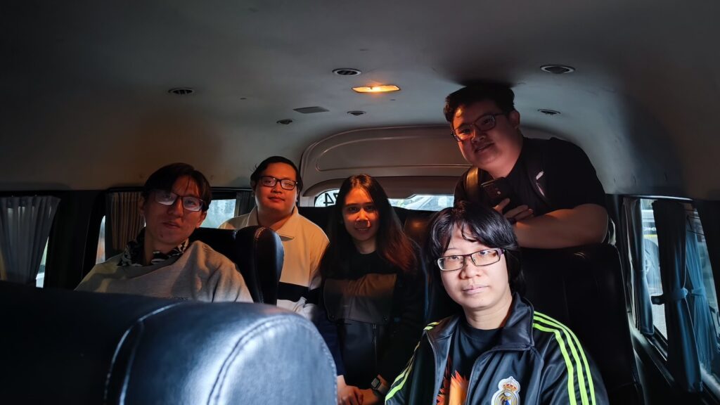 Photo of Bandung team inside the minibus, 5 persons.